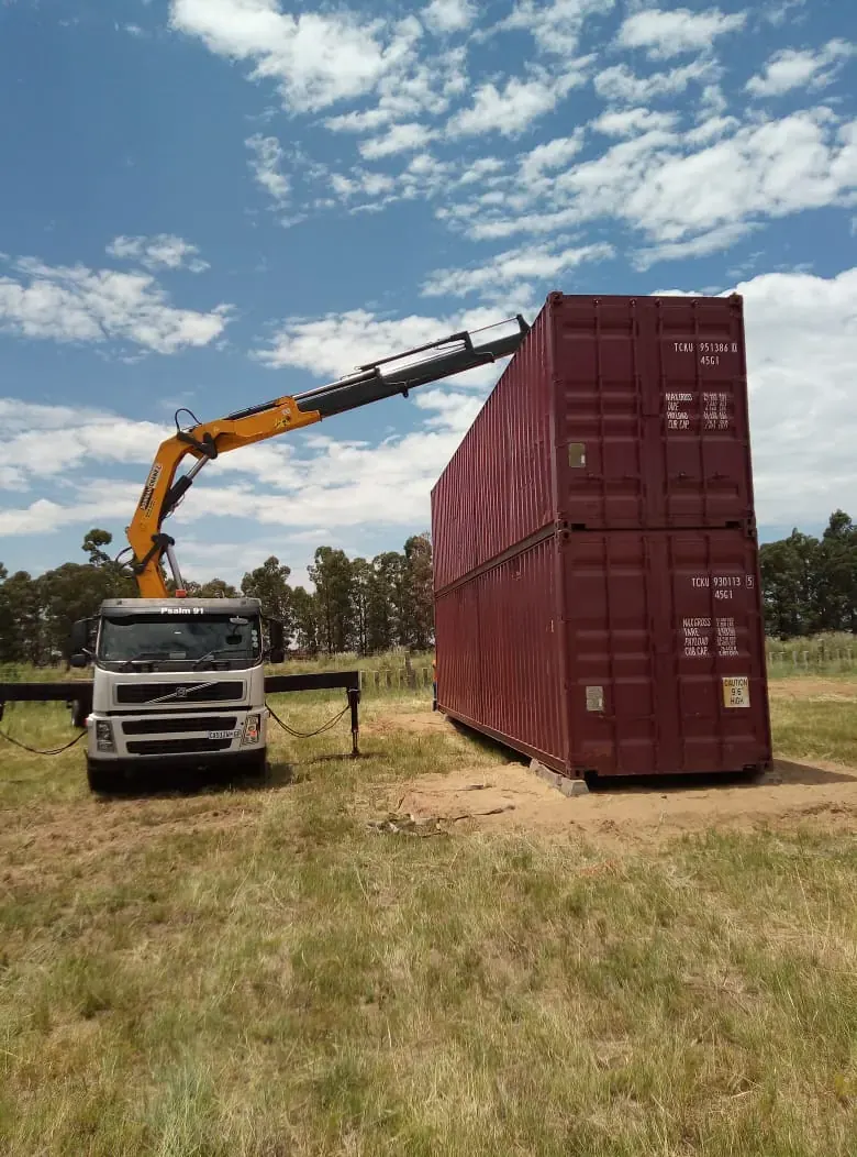Container transportation vehicle with lifting equipment